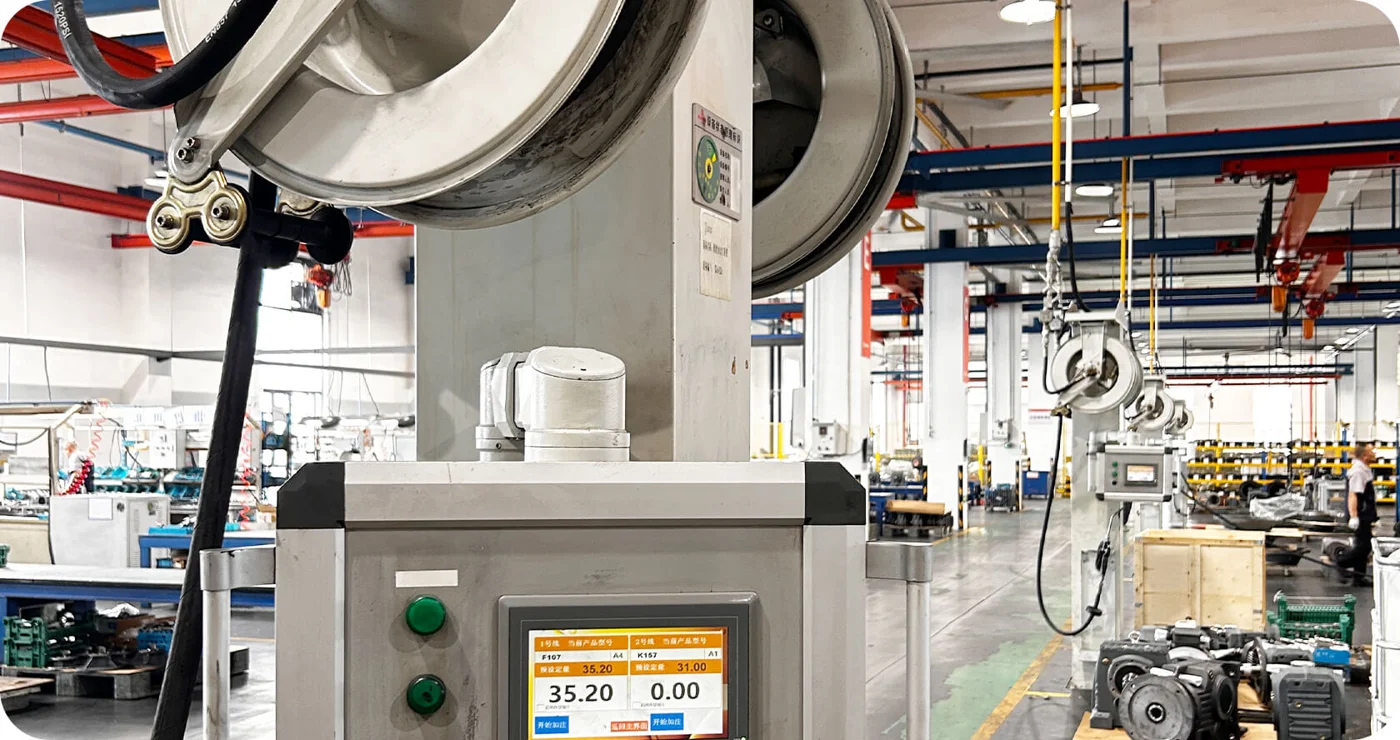 Supror official workshop photograph showing a row of assembly equipment and reducer housings